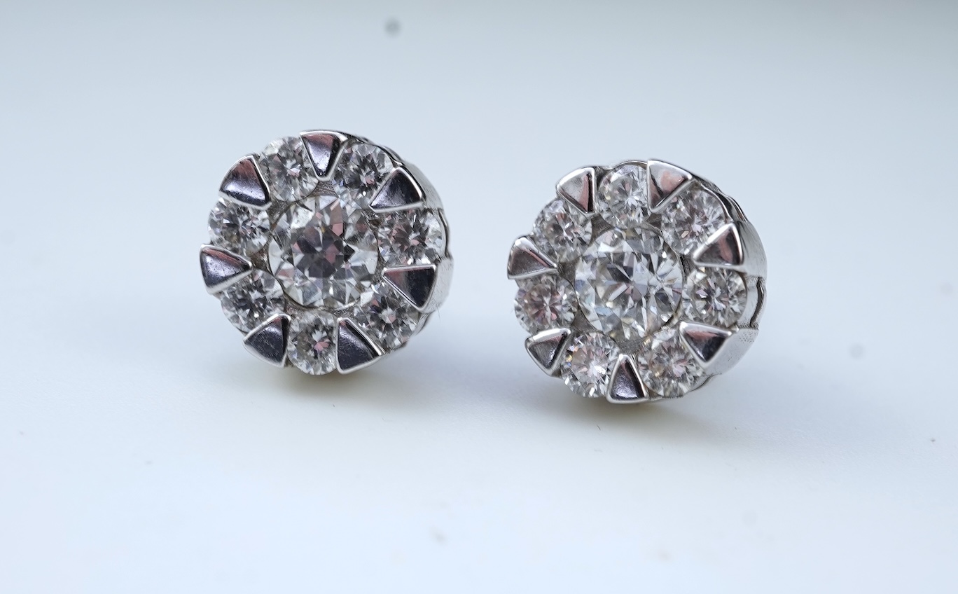 A pair of diamond stud earrings